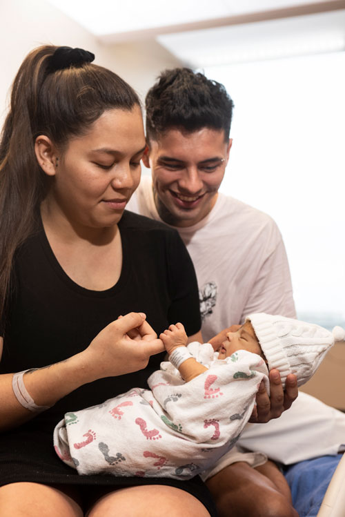 couple holding baby